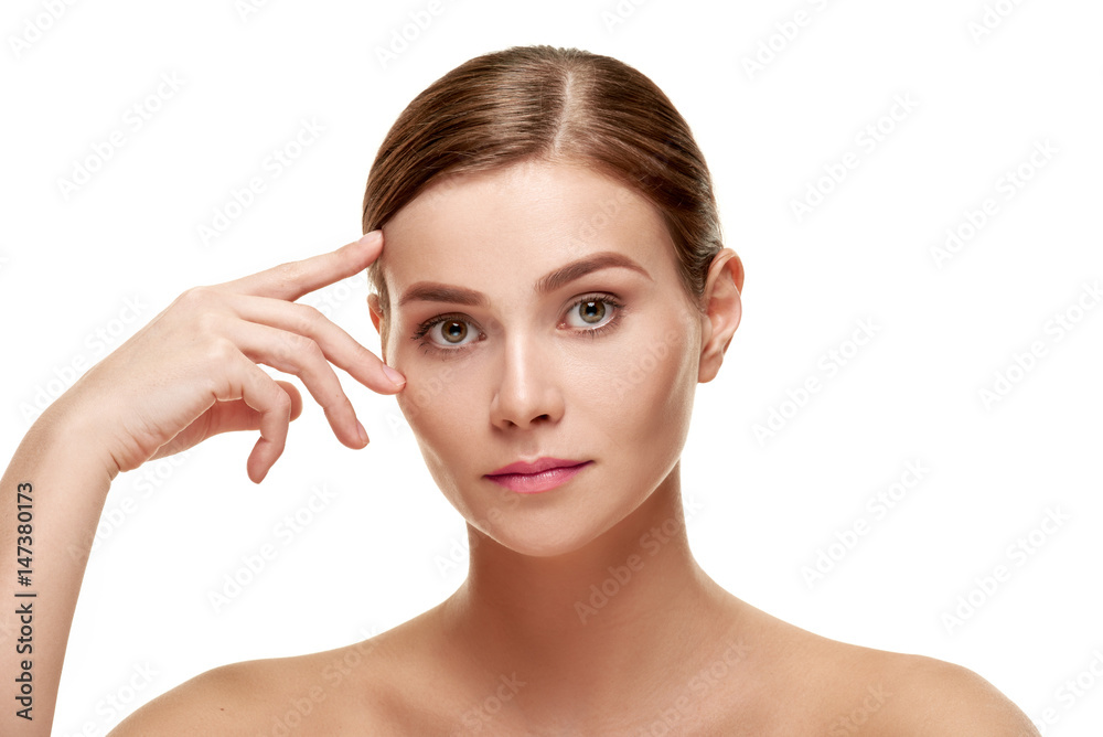 Woman touching brow