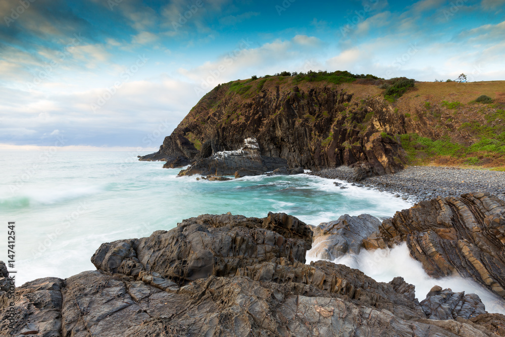 Soft morning light highlights a dreamy coastal scene on the eastern coast of Australia.