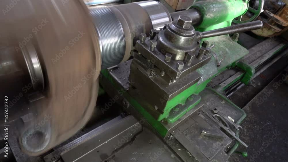 Mechanical metal working, the lathe is in the factory. Installation of the workpiece in the lathe. Rotational metal component is machined. Timelapse. Mechanical metal working, the lathe is in the factory. Installation of the workpiece in the lathe. Rotational metal component is machined. Timelapse.