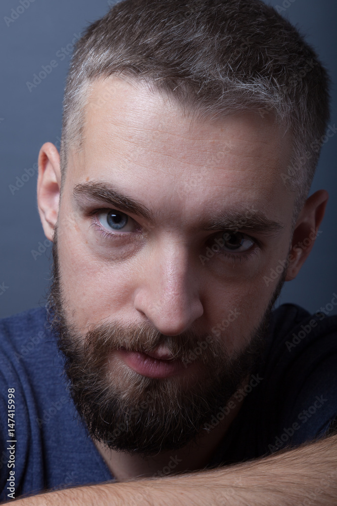 Portrait of a young man with a beard Portrait of a young man with a beard