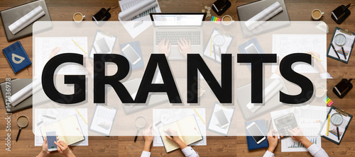 Composition (set) pictures of office items, subjects with text Grants. The woman (businesswoman, manager, student) working at office table (writes, calls, calculates, analyzes). Top view.