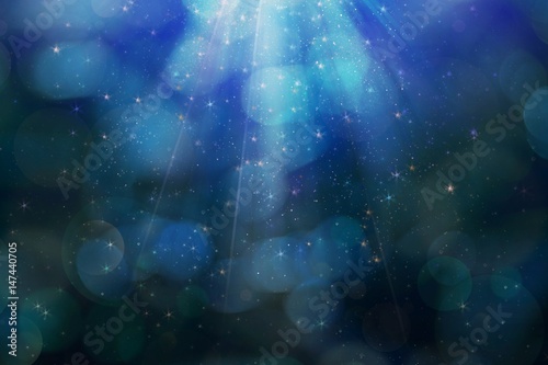 Abstract magic blue background with bokeh lights © kelifamily
