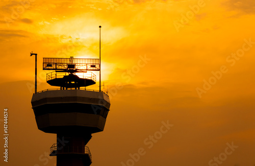 Silhouette of radar tower with twilight sky at sunset time