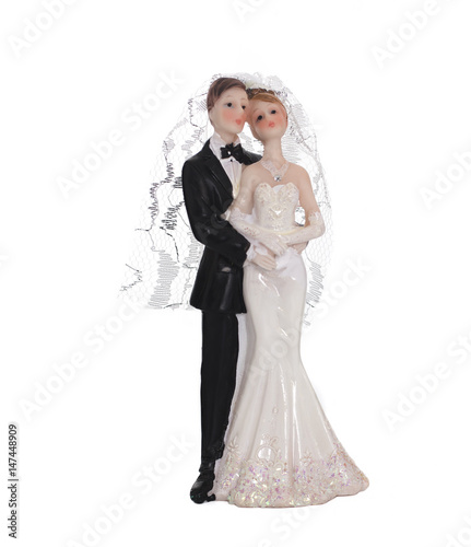 Bride and groom, old cake topper on white background