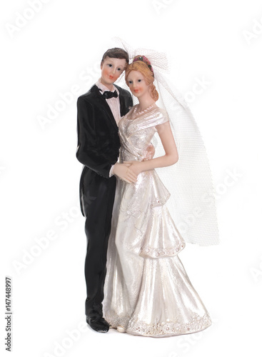 Bride and groom, old cake topper on white background