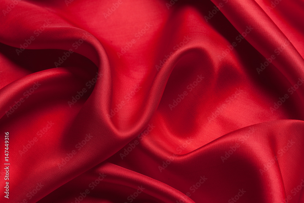 Obraz premium Red cloth waves background texture