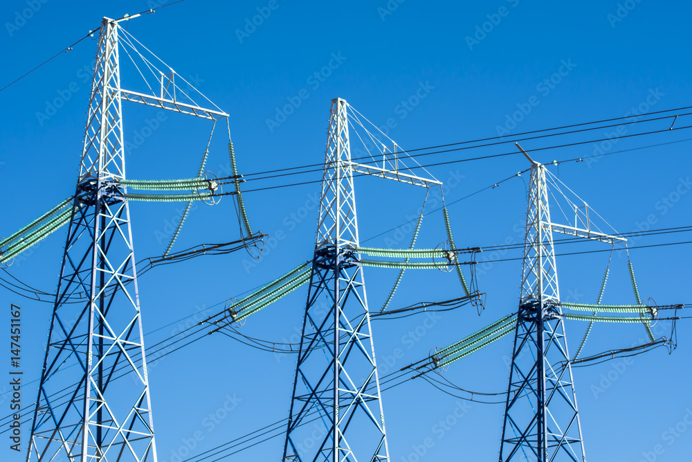Power line against the blue sky Power line against the blue sky