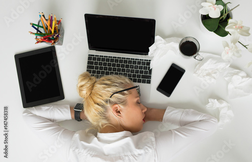 Woman sleeping in the office