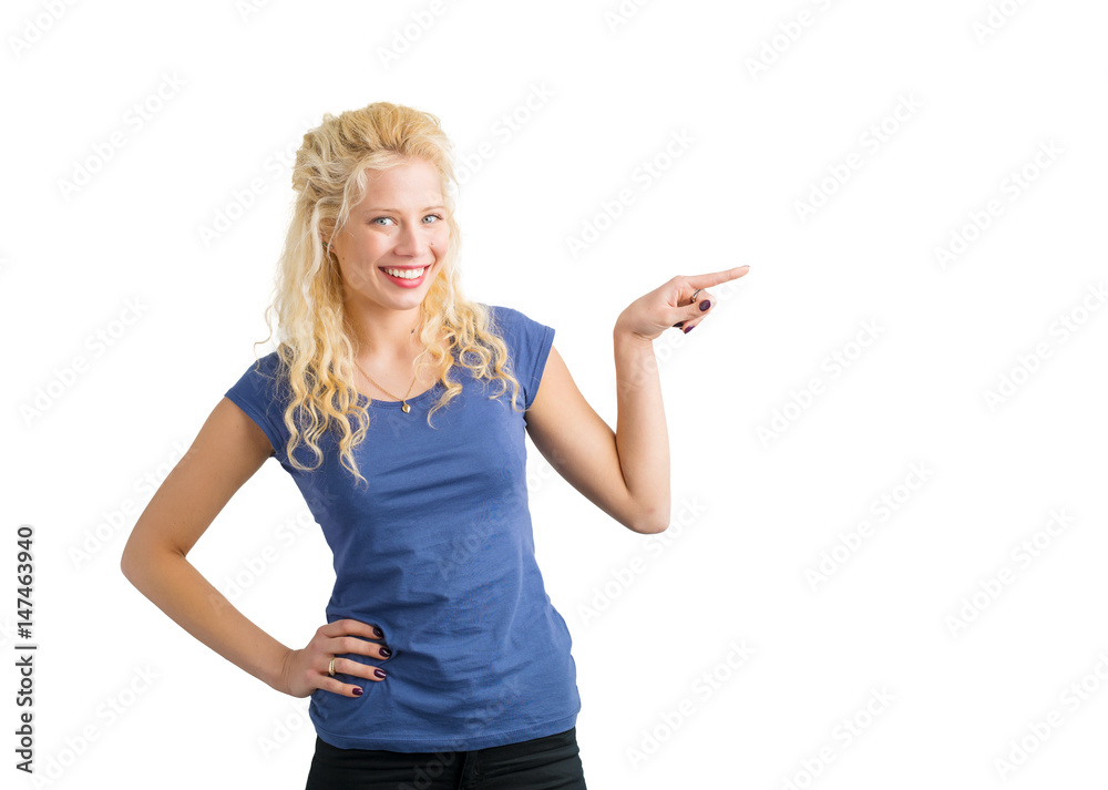 Woman pointing at something with her finger and smiling Woman pointing at something with her finger and smiling