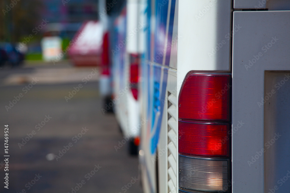 back view of bus, red side lamp back view of bus, red side lamp
