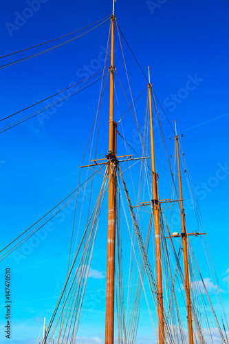 Foto Yacht mast against blue summer sky