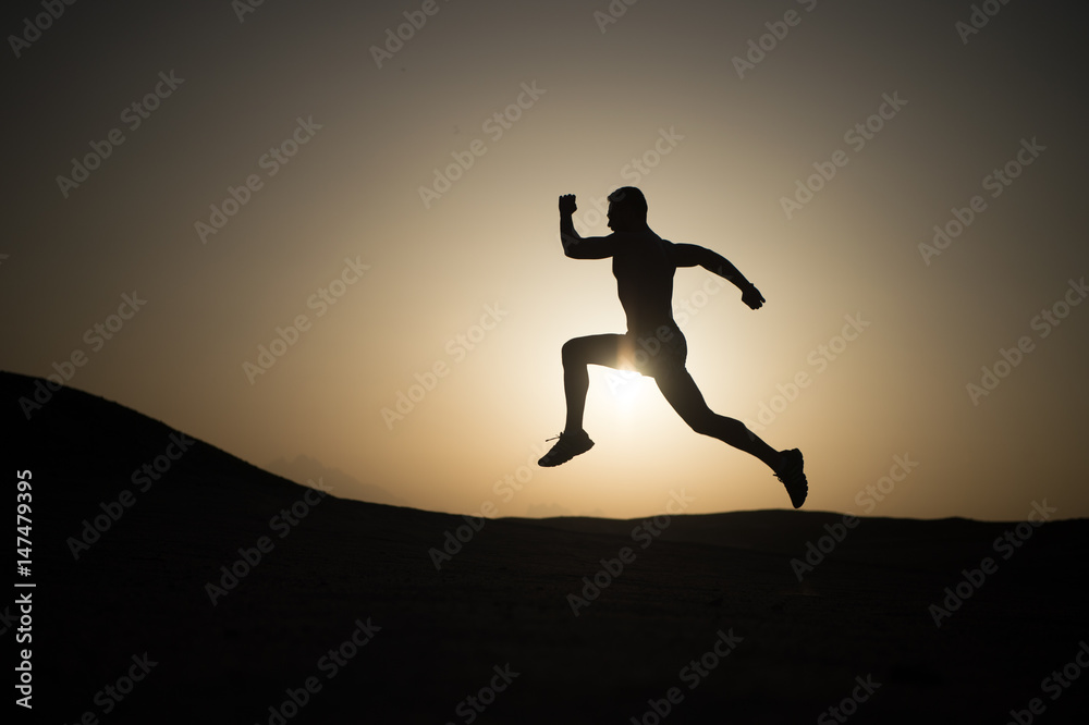 man running silhouette at sunset, young caucasian run in mountain man running silhouette at sunset, young caucasian run in mountain