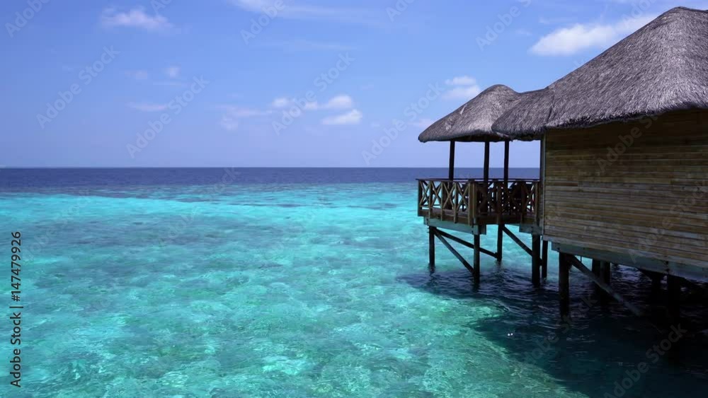 Pristine beach and water bungalows at maldivian island Pristine beach and water bungalows at maldivian island