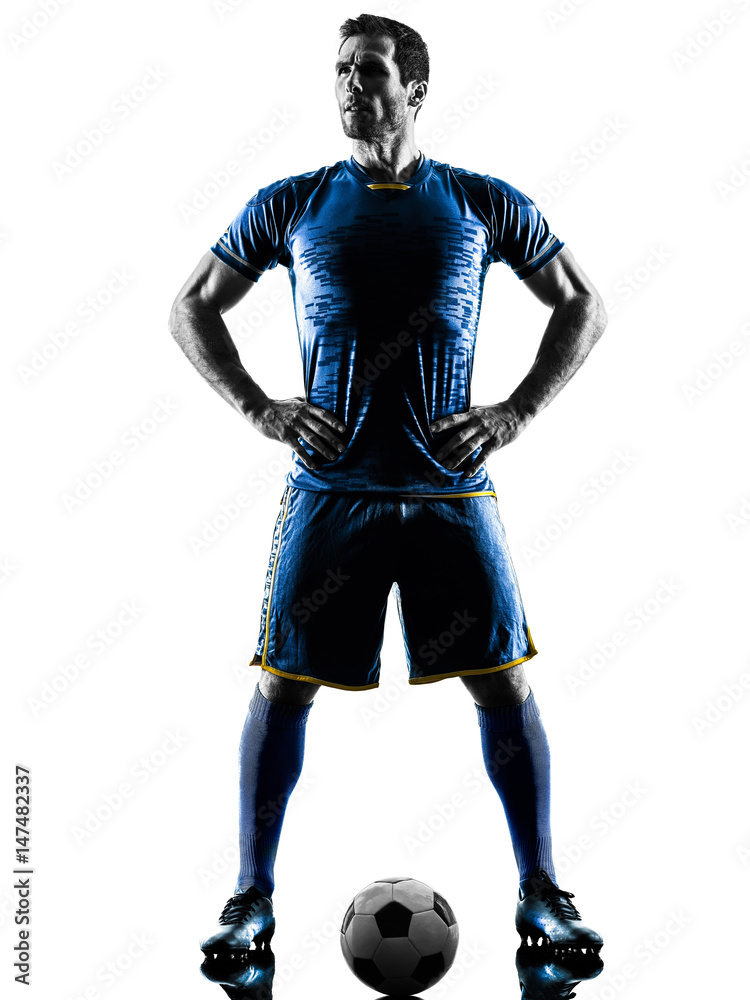 one caucasian soccer player man standing in silhouette isolated on white background one caucasian soccer player man standing in silhouette isolated on white background