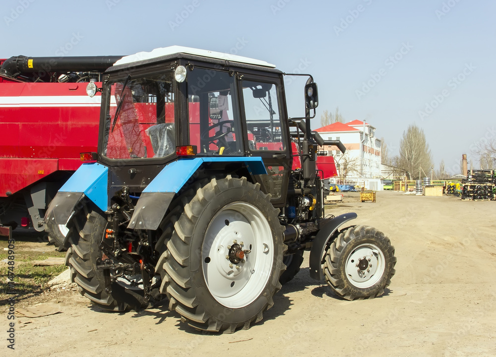 Harvesters and harvester parts at the plant are waiting for assembly, tractors and agricultural machinery Harvesters and harvester parts at the plant are waiting for assembly, tractors and agricultural machinery
