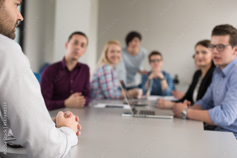 Business Team At A Meeting at modern office building Business Team At A Meeting at modern office building