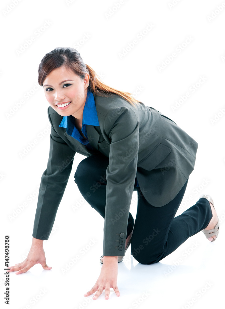 Businesswoman in ready to run pose over white background Businesswoman in ready to run pose over white background