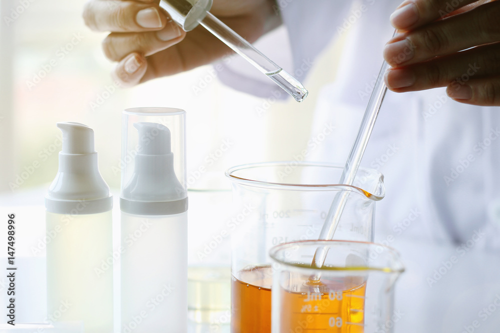 Oil pouring, Equipment and science experiments, Formulating the chemical for medicine, Organic pharmaceutical, Alternative medicine concept. (Selective Focus)