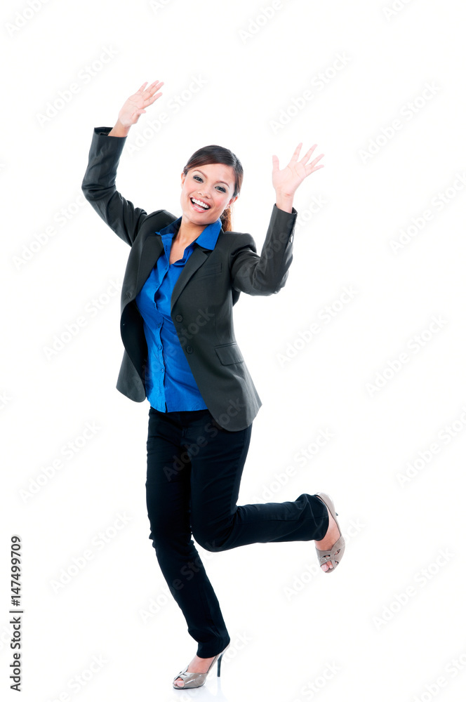 Happy young business woman celebrating success over white background