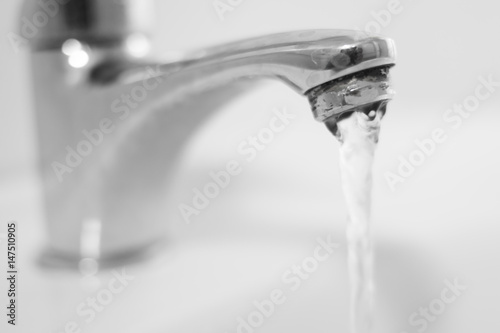 Bathroom sink tap with running water