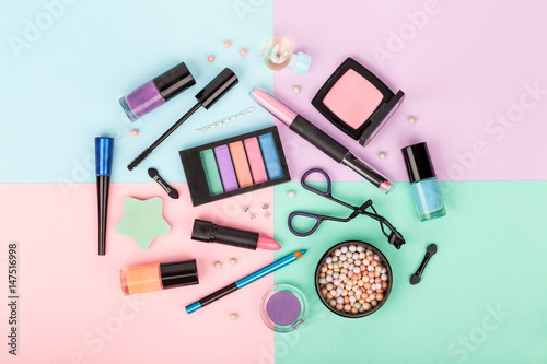 set of professional decorative cosmetics, makeup tools and accessory on colorful background. beauty and fashion concept. flat lay composition, top view