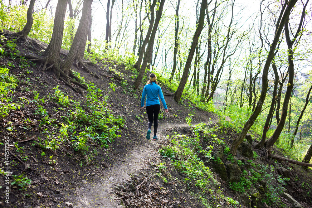 Girl running in the woods.. Girl running in the woods..