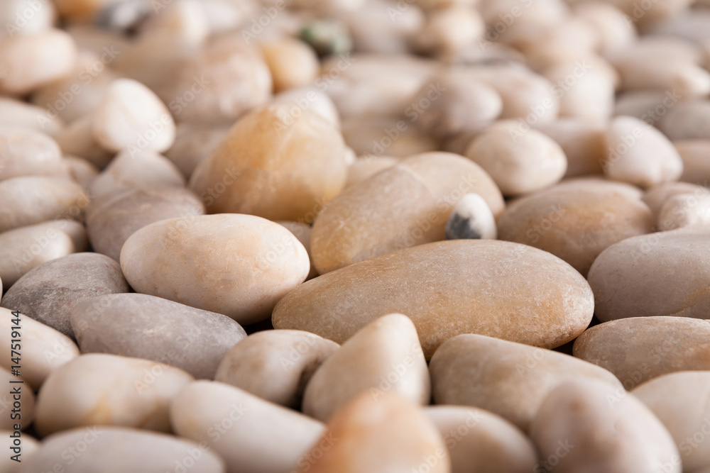 Sea pebbles background, natural seashore stones Sea pebbles background, natural seashore stones