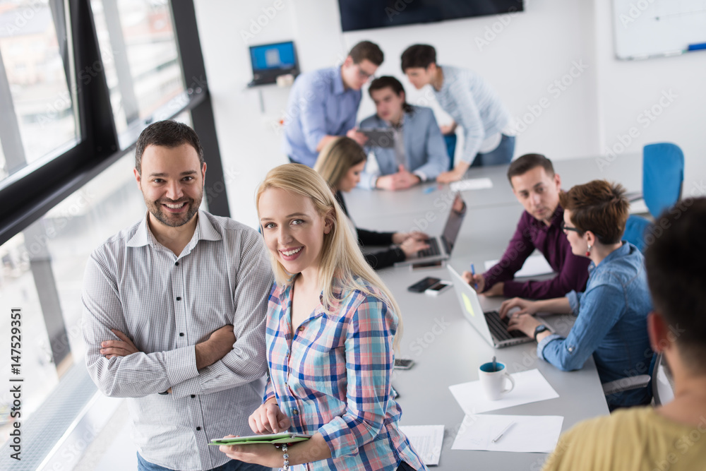 Two Business People Working With Tablet in office Two Business People Working With Tablet in office