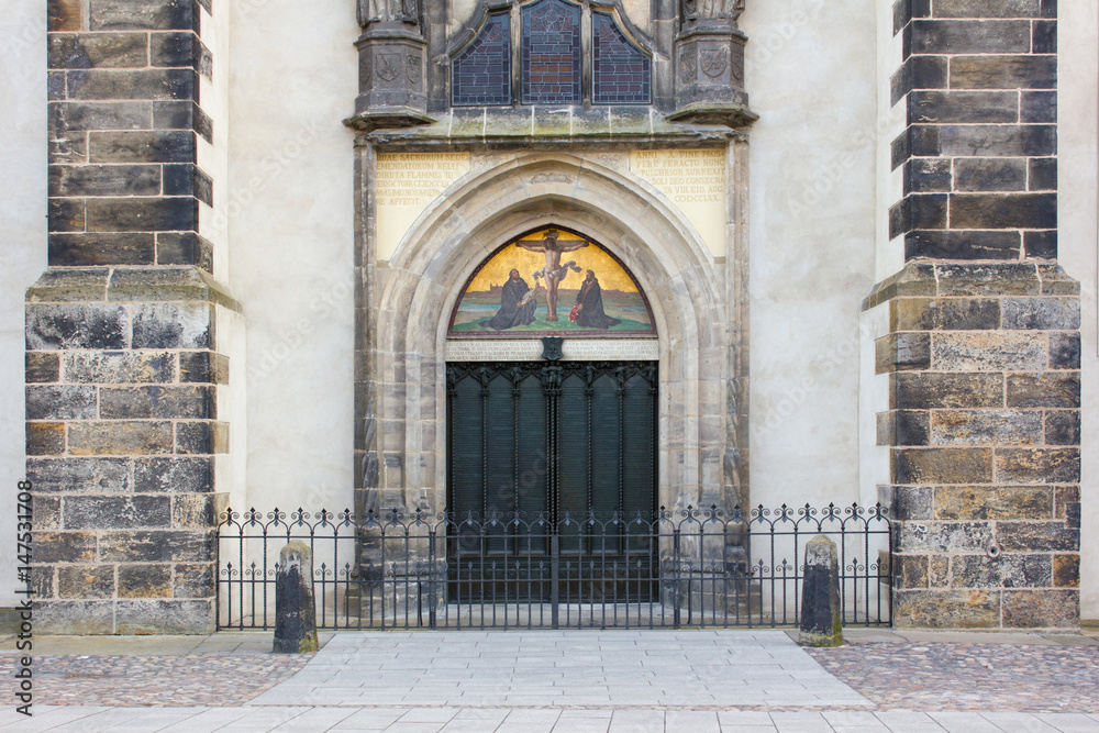 church door  / Door with theses  of the castle church in the Luther city Wittenberg