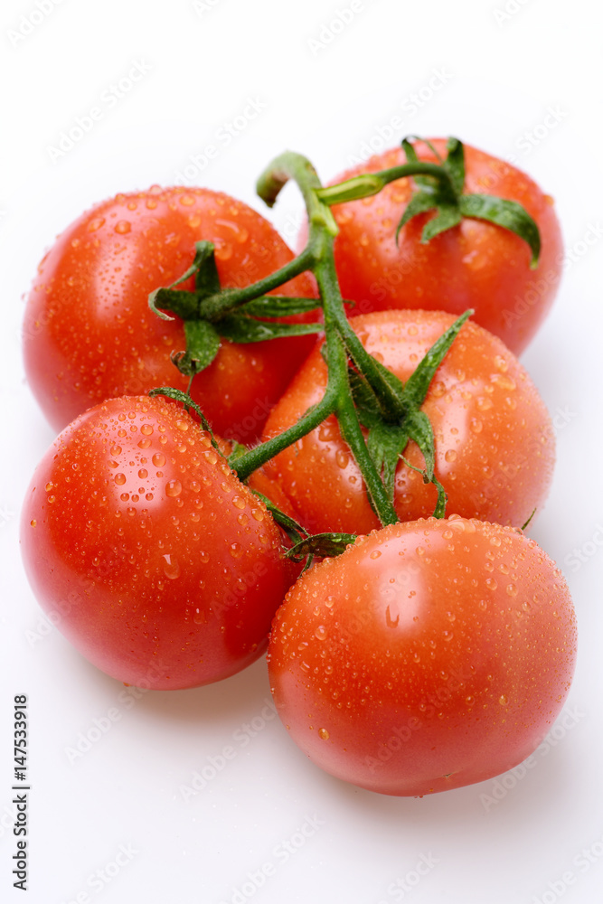 Ripe natural tomatoes on vine. Market fresh vegetable concept Ripe natural tomatoes on vine. Market fresh vegetable concept