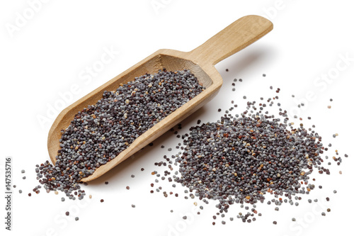 Poppy seeds in wooden scoop