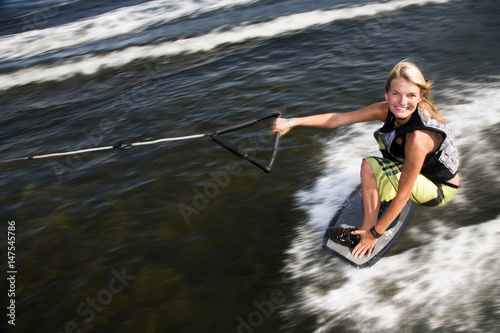 Woman wakeskating photo