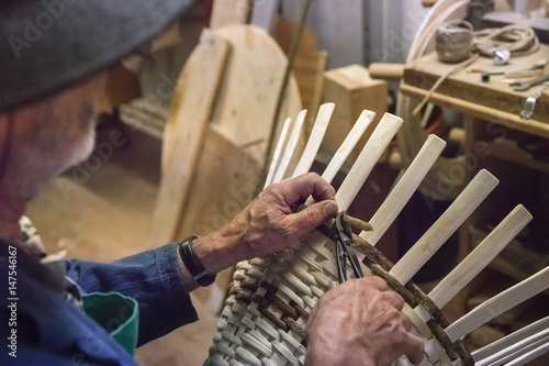 Craftsman at work in the dolomites village, Villabassa, South Tyrol, Italy photo