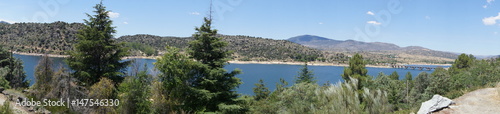 The El Burguillo Reservoir panoramic view. It is located along the Alberche river in the province of Ávila, Spain, between the municipalities of El Tiemblo and El Barraco. © raquelmanteca