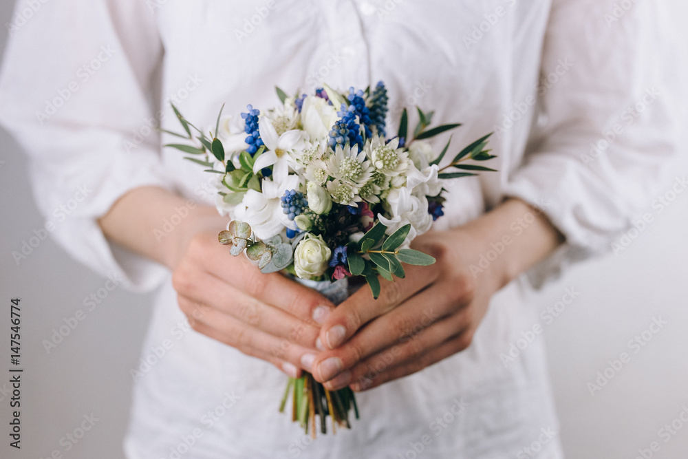 Beautiful bouquet in the hands of a florist Beautiful bouquet in the hands of a florist