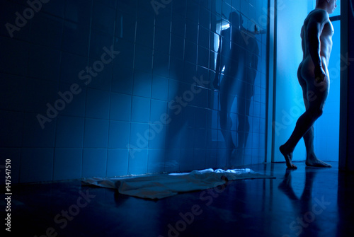 Man walking into shower photo