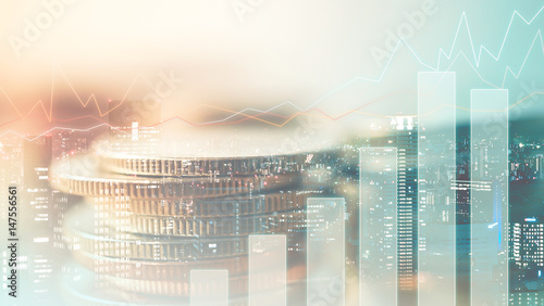 Double exposure of city , graph and rows of coins for finance and banking concept