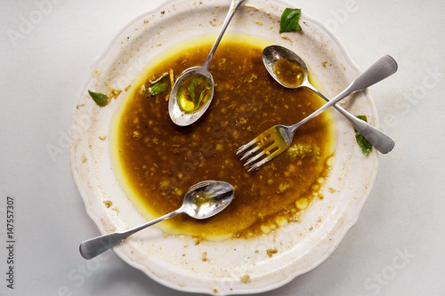 Plate with olive oil, vinegar and cutlery