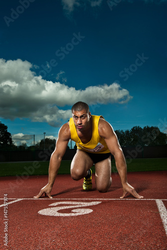 Athlete preparing to race on sportstrack photo