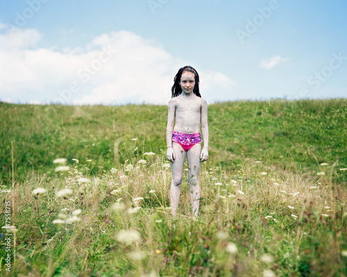 Portrait of a girl standing in a meadow, Nowica, Poland photo