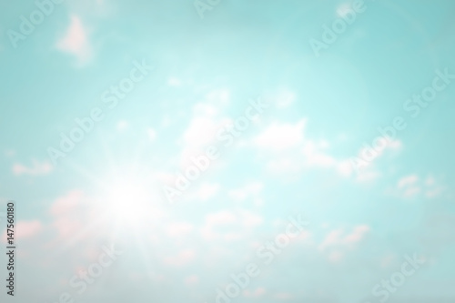Abstract sky with bright sunlight and flare blurred background.
