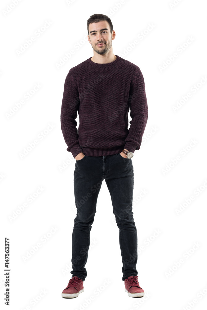 Friendly smiling happy casual man with hands in pockets looking at camera. Full body length portrait isolated over white studio background. Friendly smiling happy casual man with hands in pockets looking at camera. Full body length portrait isolated over white studio background.