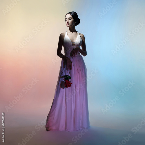 Silhouette elegant woman on colors background