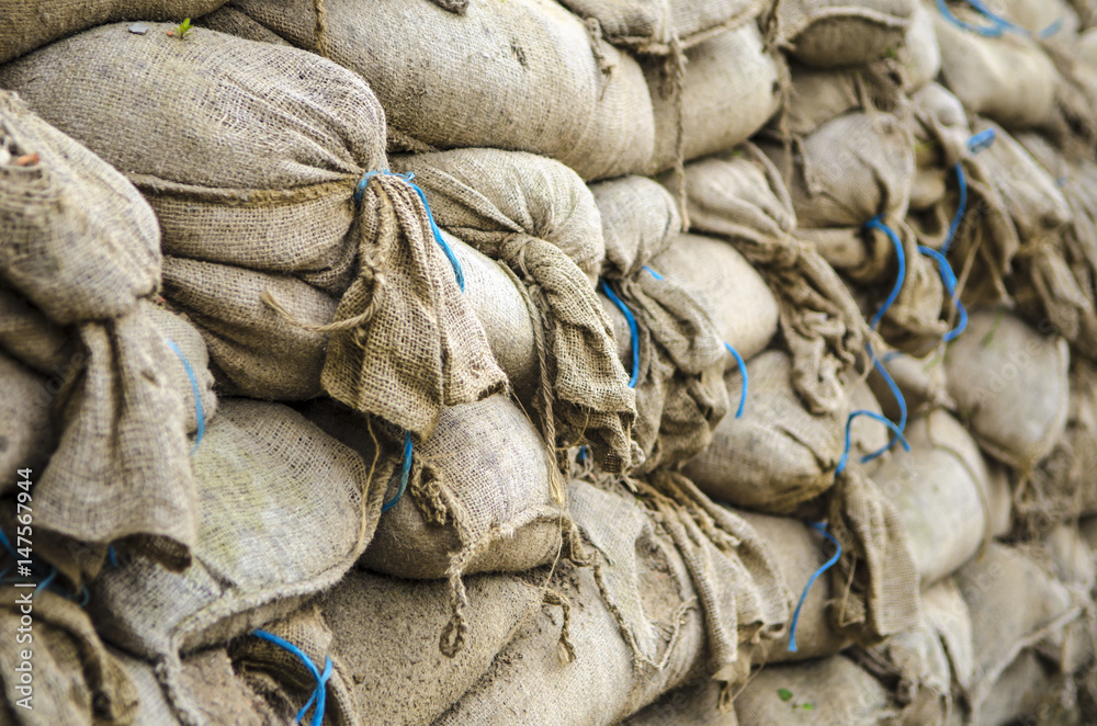 Old sandbag wall for flooding defense or fortification, Stock Photo
