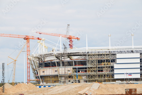Cranes at work . Stadium construction. construction of sports facilities