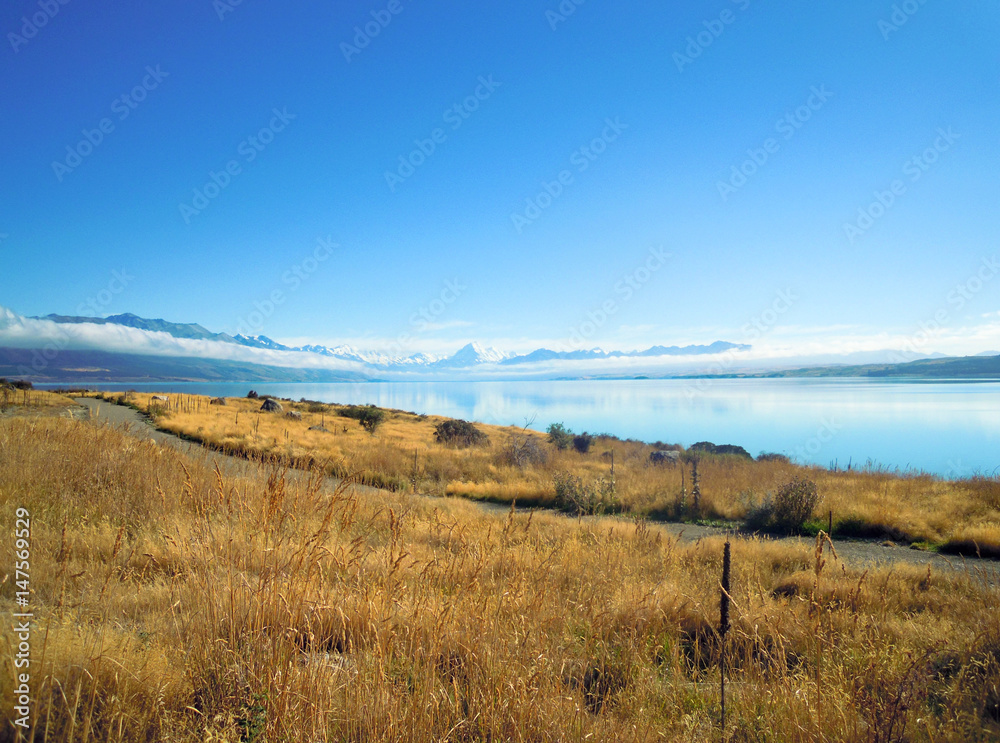 Mount Cook reflecting in Lake Pukaki, New Zealand - Stock Photo