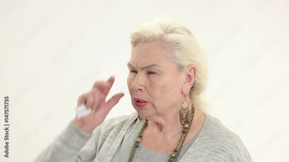 Old woman holding pills isolated. Senior lady having headache. Common health issues. Old woman holding pills isolated. Senior lady having headache. Common health issues.