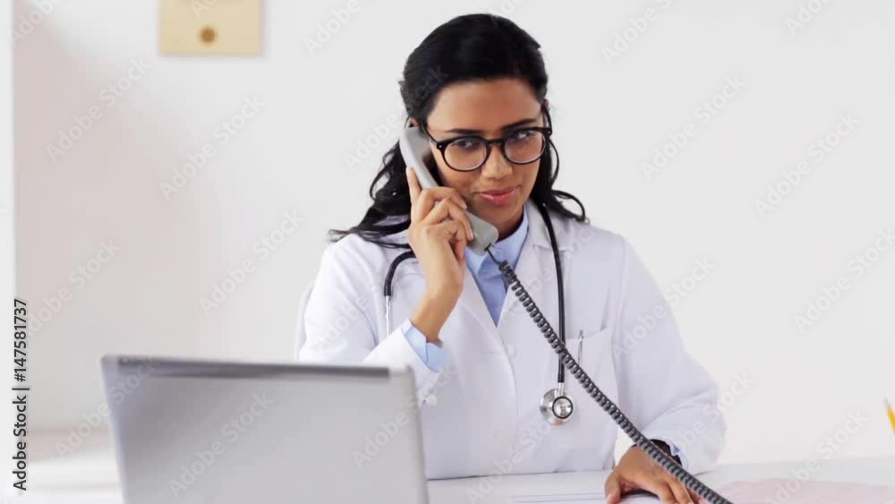 doctor with papers calling on phone at hospital doctor with papers calling on phone at hospital