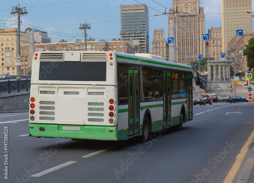 bus goes along street