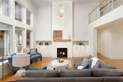 Фотография Luxurious Living Room with Hardwood Floors, Fireplace, and Large Windows in New